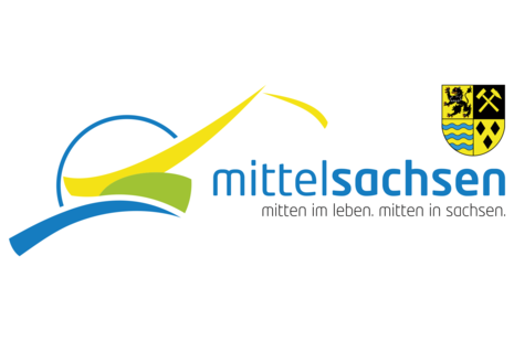 Logo des Landkreises Mittelsachsen: das Wappen mit dem Schriftzug "Mitten im Leben. Mitten in Sachsen."